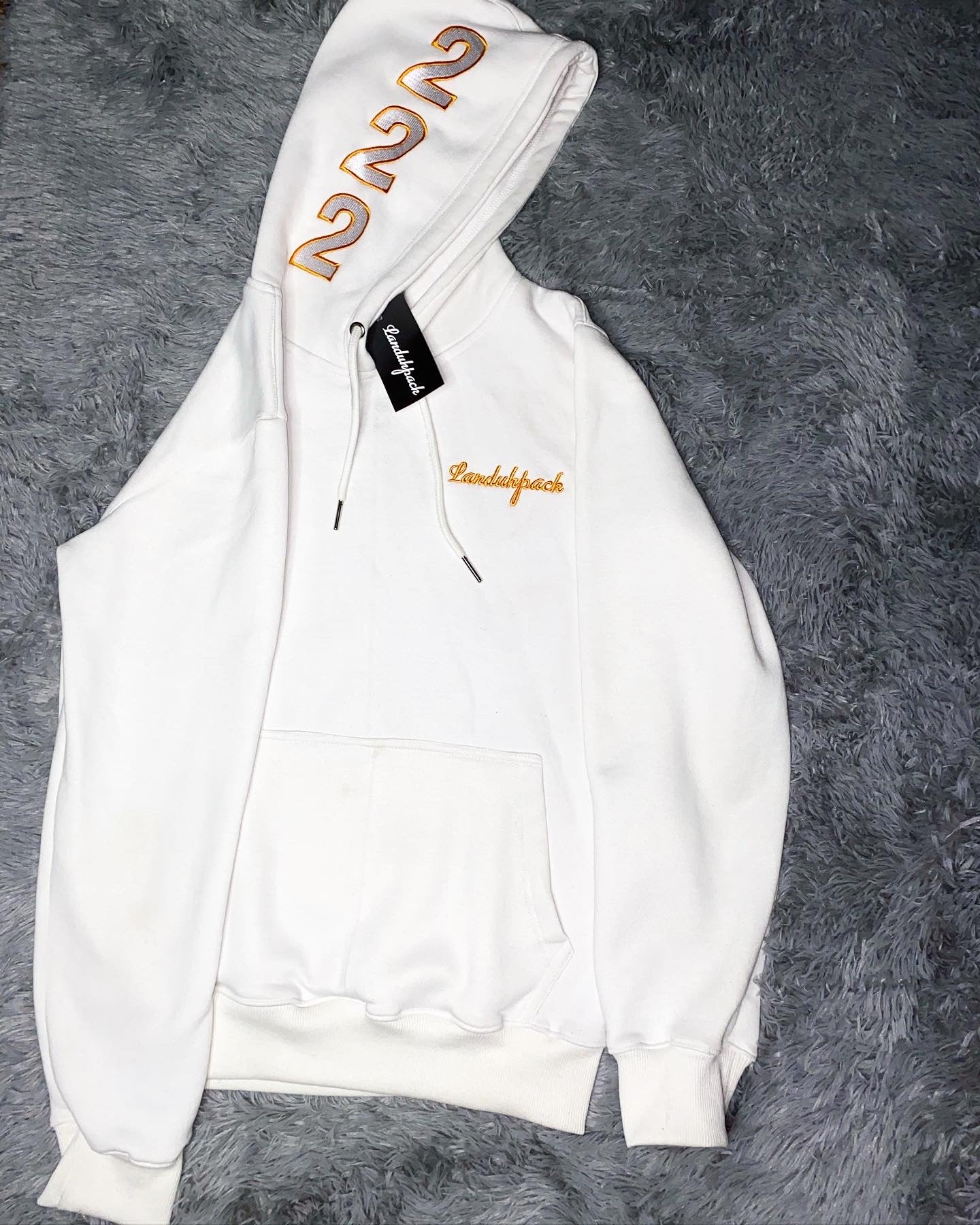 White landuhpack hoodie with angle number 222